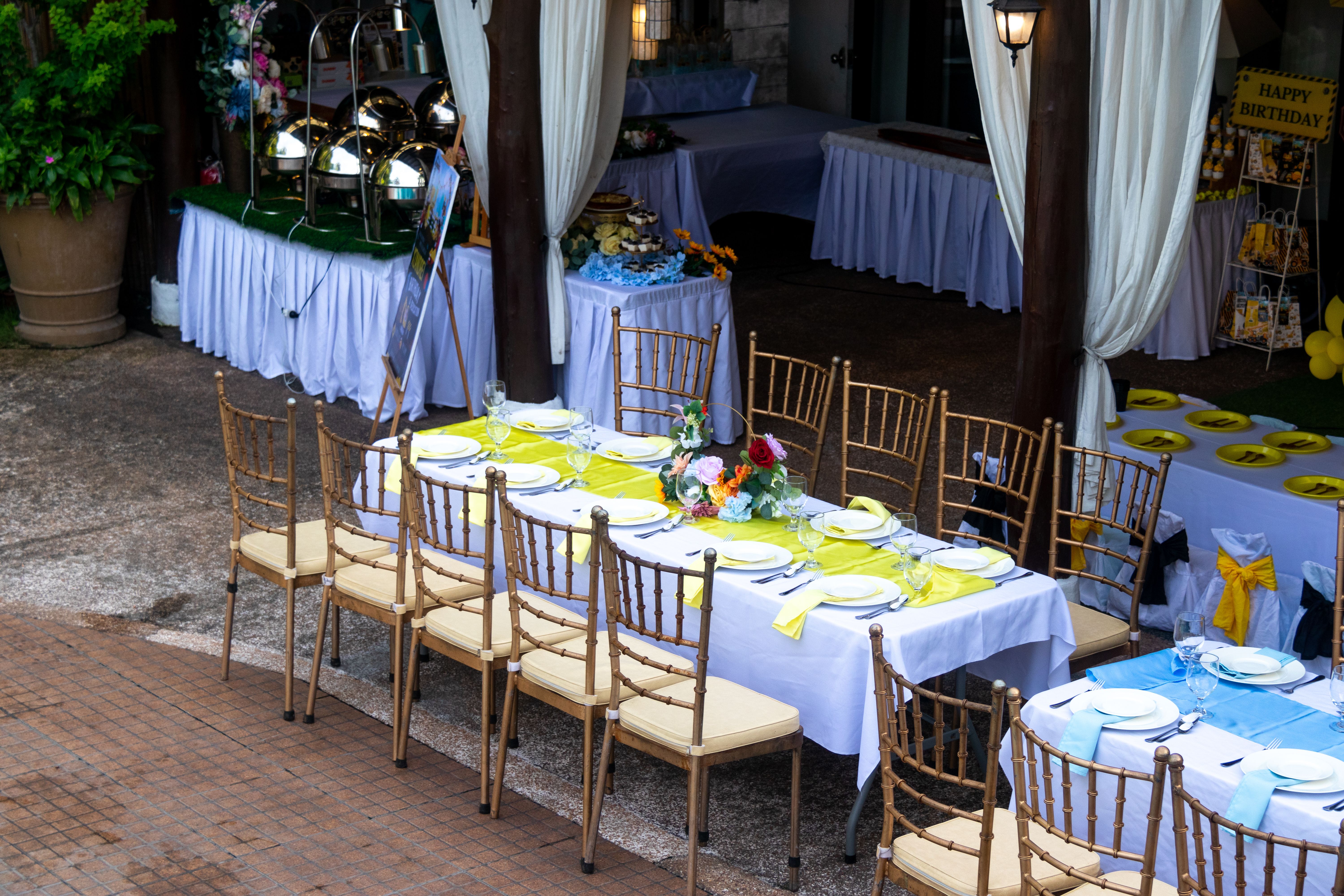 Organized outdoor dining area with tables and seating, representing durable social and refreshment spaces at a festival.